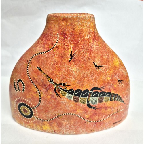 Red Triangle Vase featuring traditional Aboriginal art designs. Red Triangle Vase featuring traditional Aboriginal art designs.