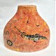 Red Triangle Vase featuring traditional Aboriginal art designs. Red Triangle Vase featuring traditional Aboriginal art designs.