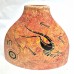 Red Triangle Vase featuring traditional Aboriginal art designs. Red Triangle Vase featuring traditional Aboriginal art designs.